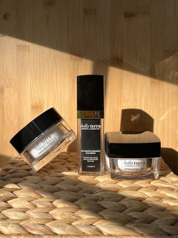 Bella Terra cosmetics trio arranged on a wooden surface