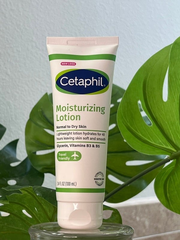 Cetaphil Moisturizing Lotion tube beside a monstera leaf